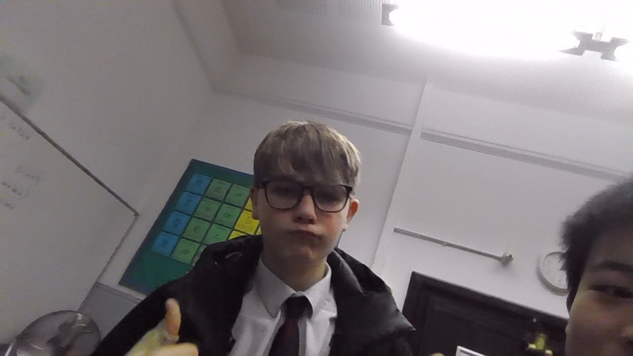 Arthur giving a thumbs-up in a classroom